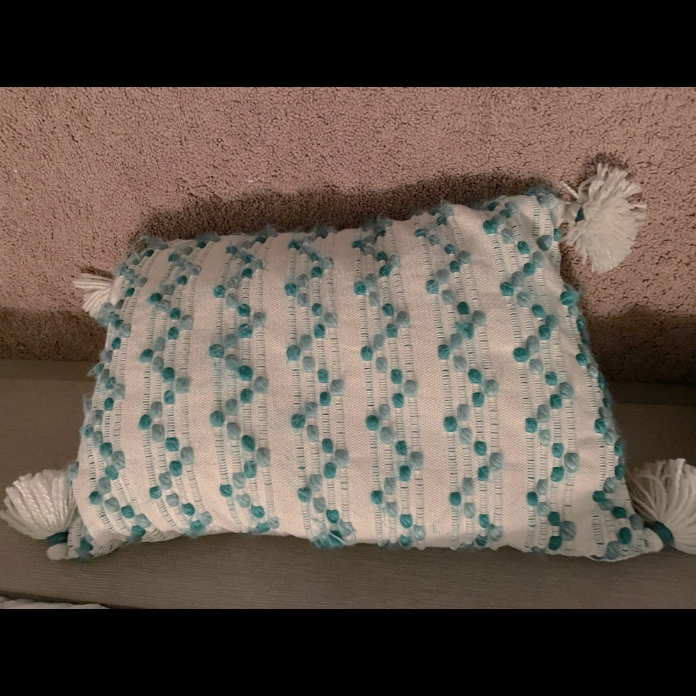 Throw pillow with teal/aqua dots